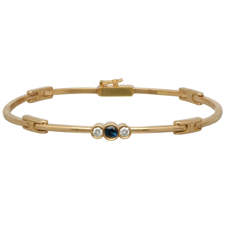 14Krt. gouden armband gezet met blauwe saffier en Briljant 0.20Ct.