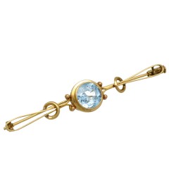 Gouden vintage broche met blauwe topaas