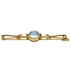 Gouden vintage broche met blauwe topaas