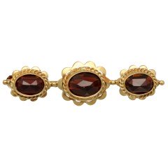 14 Krt vintage broche met granaten.